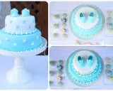 Deliciosas tartas de gominolas para bautizos, decoradas con estrellas y zapatitos de bebé en tonos azules y blancos.