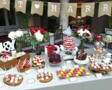 Una mesa dulce boda con pasteles, cupcakes, macarons y flores. ¡Un festín para los ojos y el paladar!